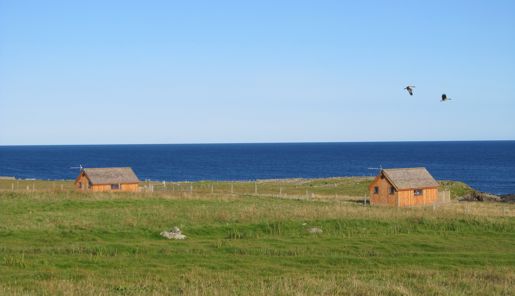 The Hebridean Huts on a sunny day overlooking the ocean on the Isle of Lewis in the Outer Hebrides in Scotland