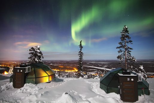 View from the glass domes towards the sky and snow covered valley from Golden Crown in Finnish Lapland