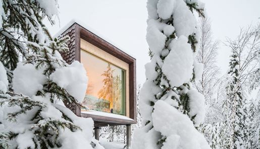 Exterior of Arctic Treehouse in Finnish Lapland during winter