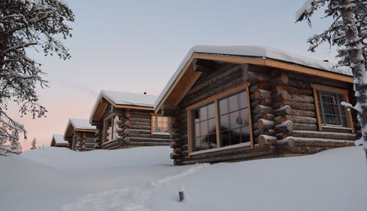 Log cabin at Muotka Wilderness Hotel in Winter