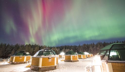 Northern Lights over the glass igloos at Snowhotel in Finnish Lapland