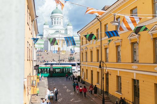 View up a street adorned with bunting towards the Helsinki Cathedral in Finland's capital