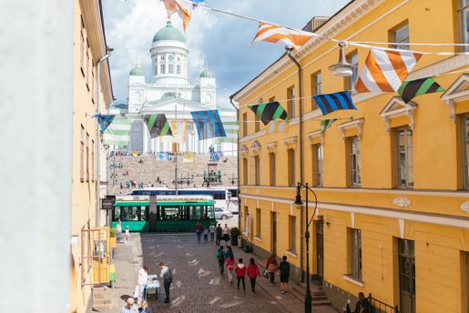 View up a street adorned with bunting towards the Helsinki Cathedral in Finland's capital