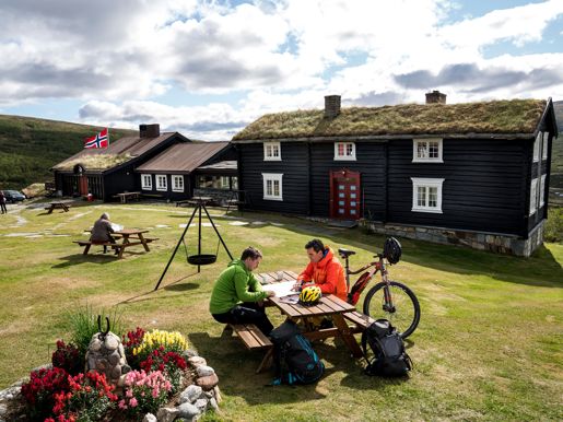 Cyclists Planning Their Trip At Grimsdalshytta Lodge