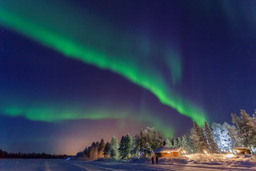 Northern Lights over Muonio in the Finnish countryside at night in winter