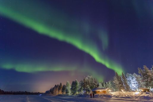 Northern Lights over Muonio in the Finnish countryside at night in winter