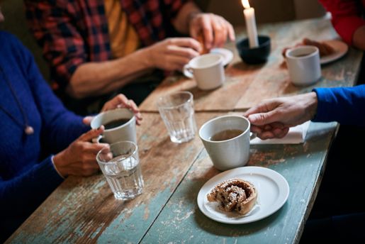 A traditional Swedish Fika of coffee and baked goods laid out on a table