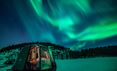 Northern Lights outside Aurora hut at Nangu in Finnish Lapland