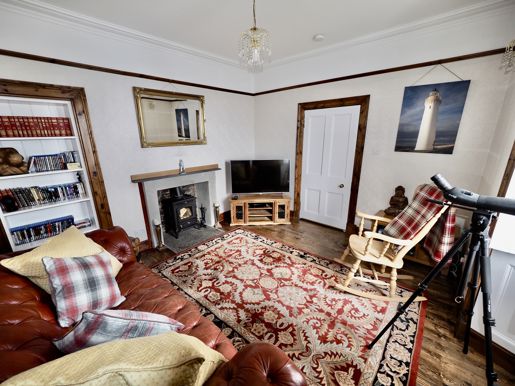 Living area around the fireplace at Cantick Head Lighthouse on Orkney in Scotland
