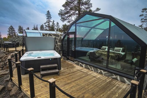 The exterior view of the glass igloo at Golden Crown during Autumn, Finnish Lapland