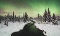 Northern Lights in front of a river in winter