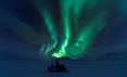 Snowmobiling experience under the Northern Lights in Longyearbyen, Svalbard