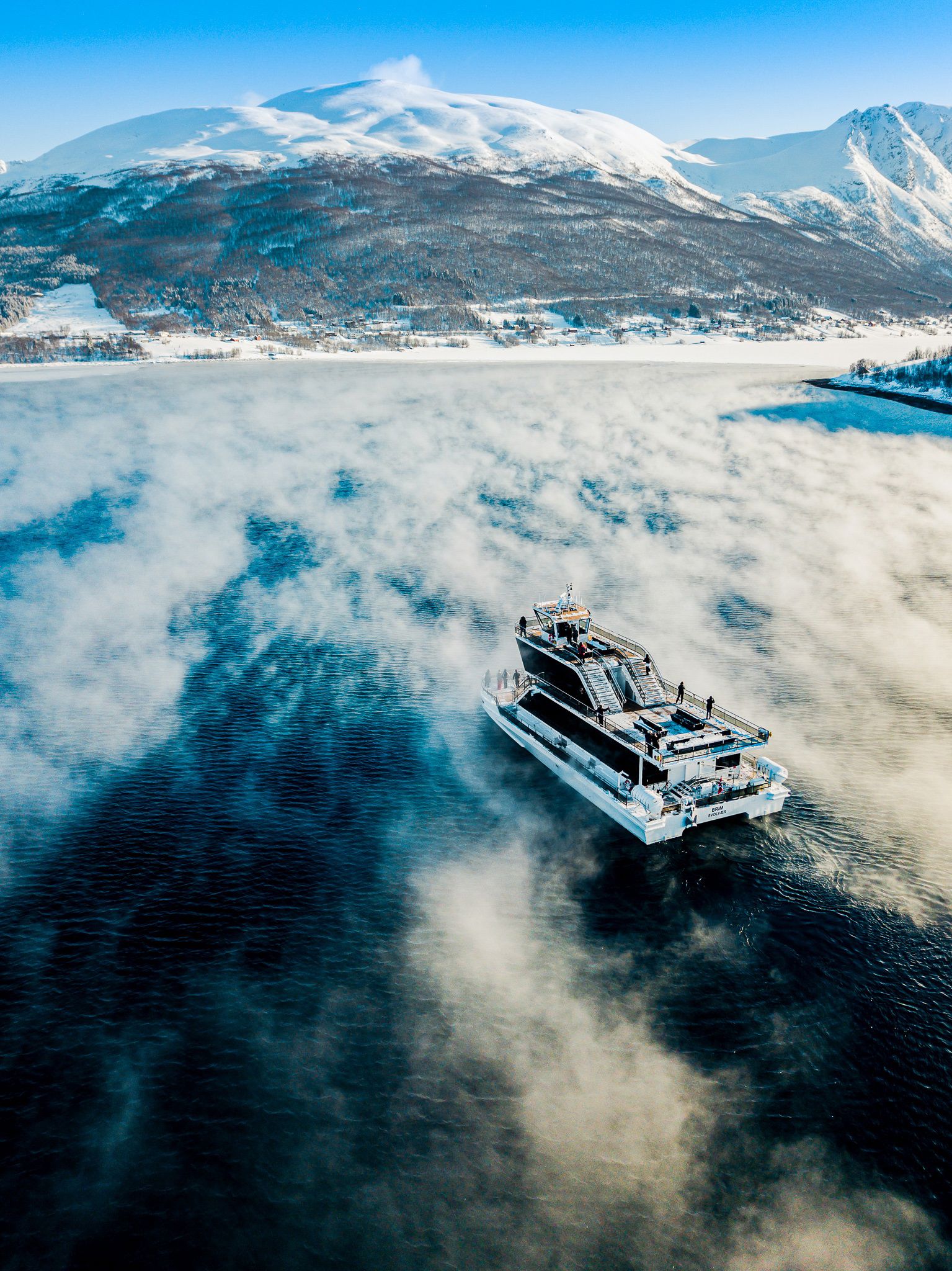 The Brim Explorer cruising across the water in Norway in winter