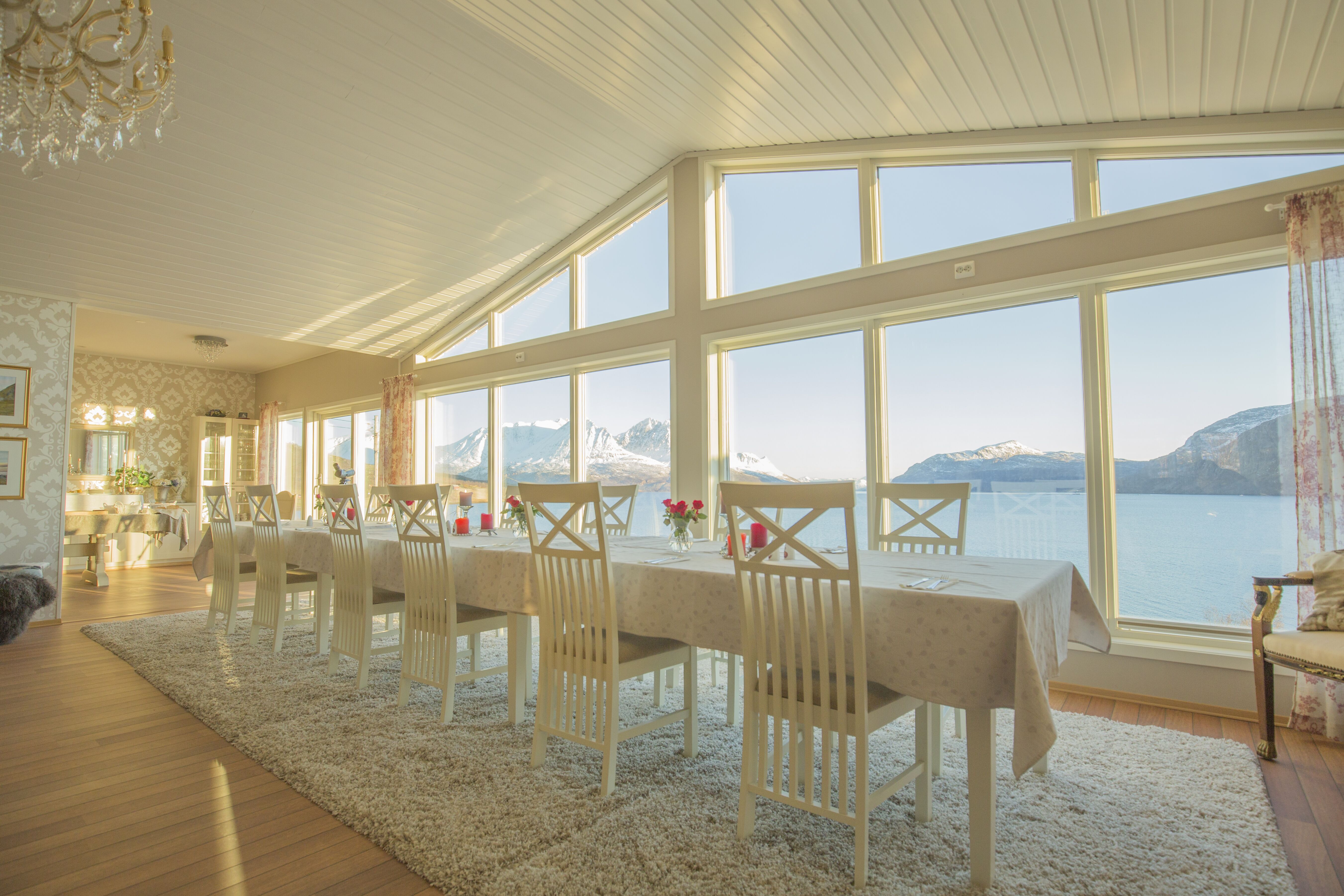 Dining area at Arctic Panorama Lodge with mountain view in Norway
